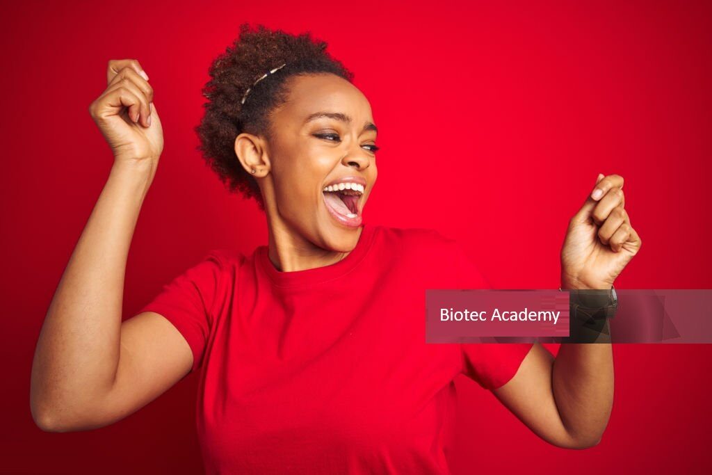 Young beautiful african american woman with afro hair over isolated red background Dancing happy and cheerful, smiling moving casual and confident listening to music