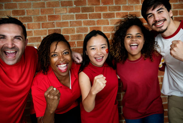 Friends cheering world cup with painted flag
